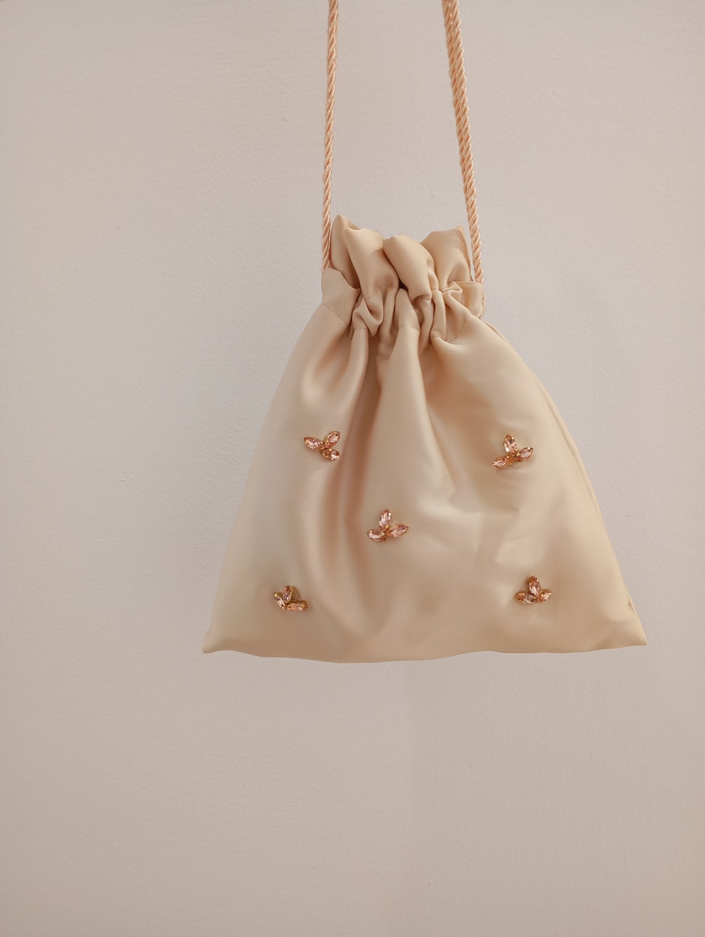 Borsa a sacchetto con strass rosa gold