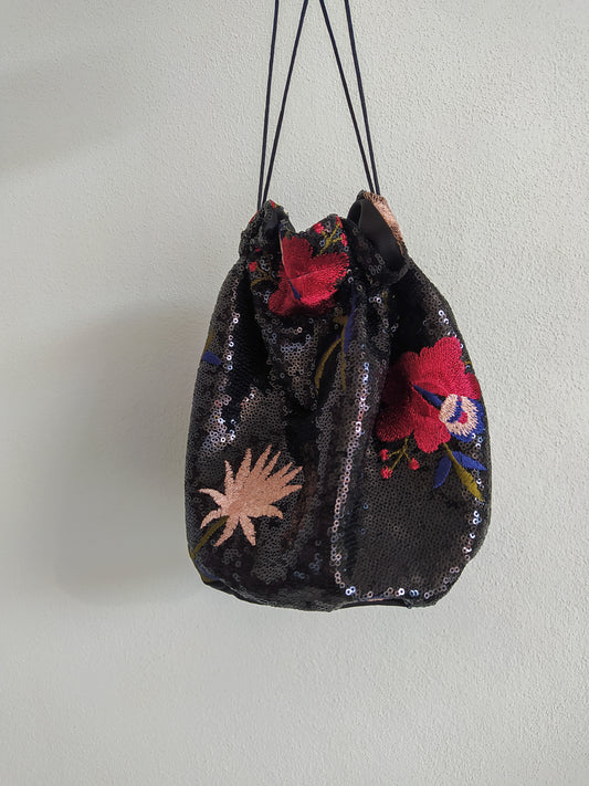 Bag with sequin fabric base